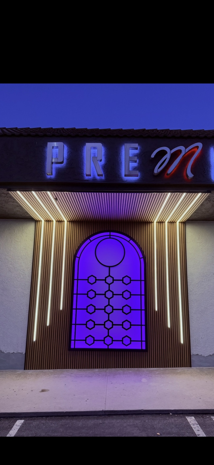 Close view of colorful illuminated commercial facade and linear lighting